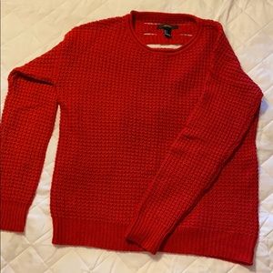 Cozy red sweater with cutouts down back